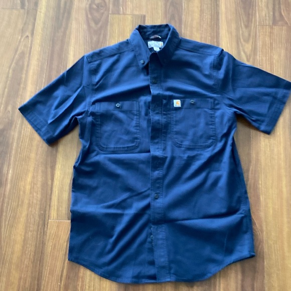 Carharrt short sleeve button down collar blue canvass. Has hidden zipup pocket - Picture 2 of 4